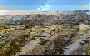 Traditional farming scene in Peru's Sacred Valley, set against the Andean highlands.