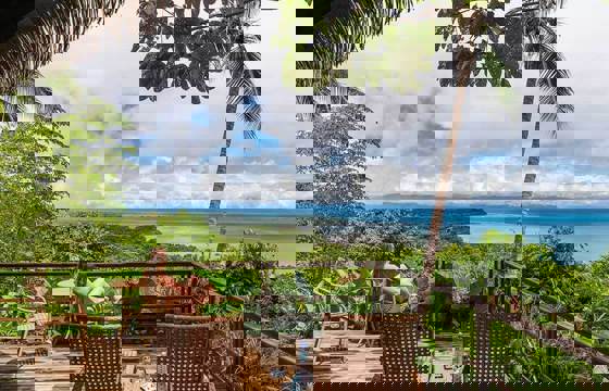 A peaceful retreat at Lapa Rios overlooks the lush Osa rainforest and sparkling Pacific horizon.