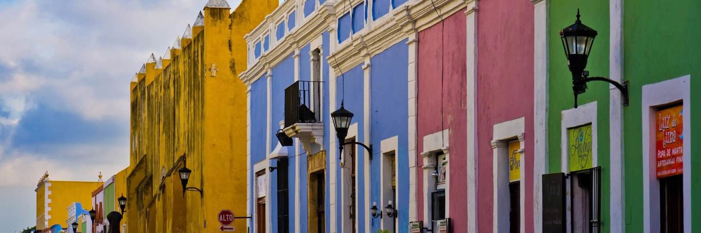Colourful colonial street with pastel buildings and outdoor cafes in the historic center of Campeche, Mexico