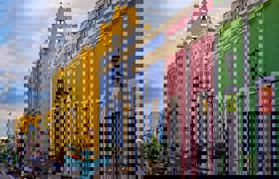 Colourful colonial street with pastel buildings and outdoor cafes in the historic center of Campeche, Mexico