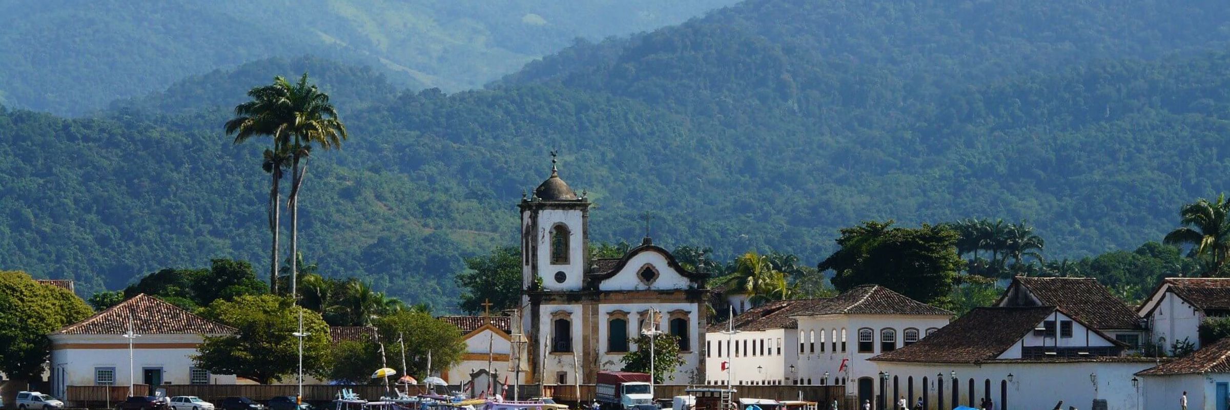 Colonial church and colourful waterfront houses in Paraty on Brazil's Costa Verde. 