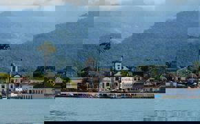 Colonial church and colourful waterfront houses in Paraty on Brazil's Costa Verde.
