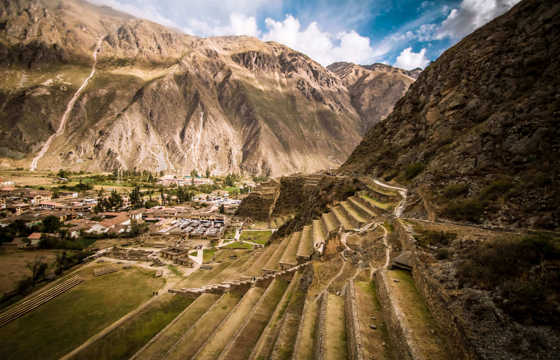 Ancient Inca terraces at Ollantaytambo archaeological site in Peru's Sacred Valley.