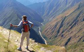 Hiker on the Inca overlooking Andes mountains near Machu Picchu, Peru adventure trek. 