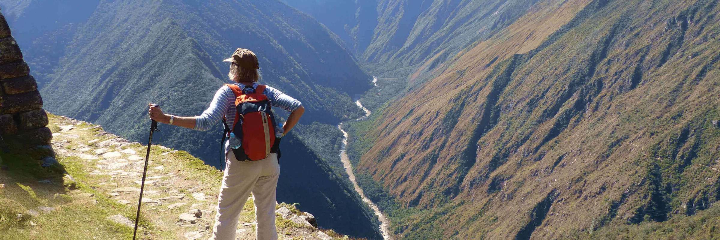 Hiker on the Inca overlooking Andes mountains near Machu Picchu, Peru adventure trek. 