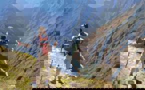 Hiker on the Inca overlooking Andes mountains near Machu Picchu, Peru adventure trek.