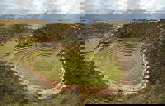 Circular Inca terraces at Moray in the Sacred Valley, Peru, used for ancient agricultural experiments.