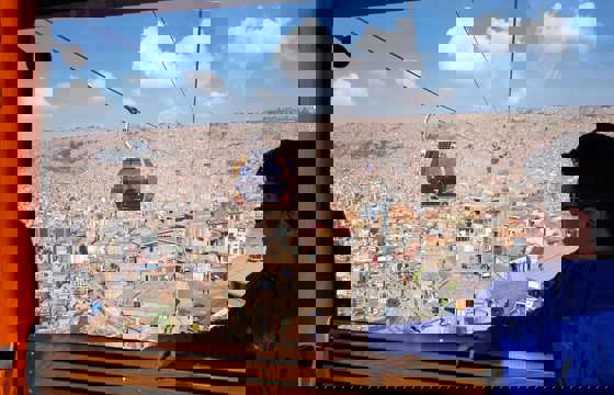 La Paz's cable car glide above Bolivia's capital, framed by Andean peaks.