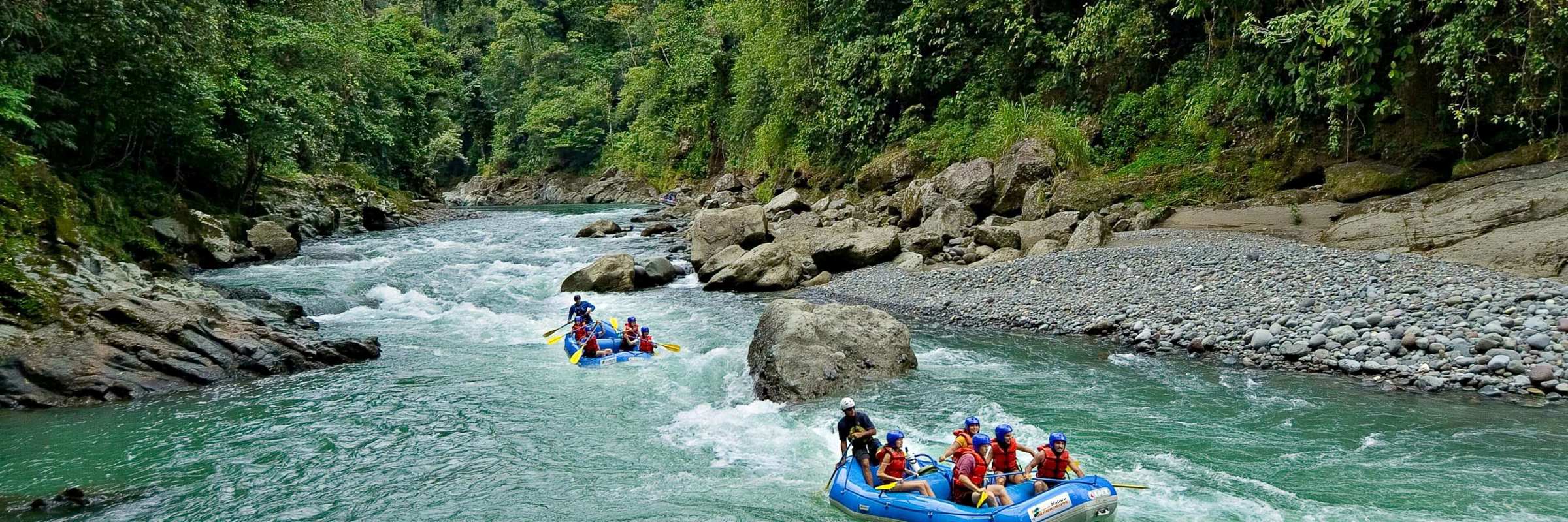 White-water rafting on the Pacuare River through lush rainforest in Costa Rica. 