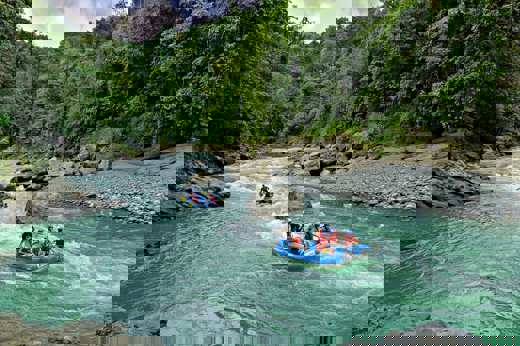 White-water rafting on the Pacuare River through lush rainforest in Costa Rica. 