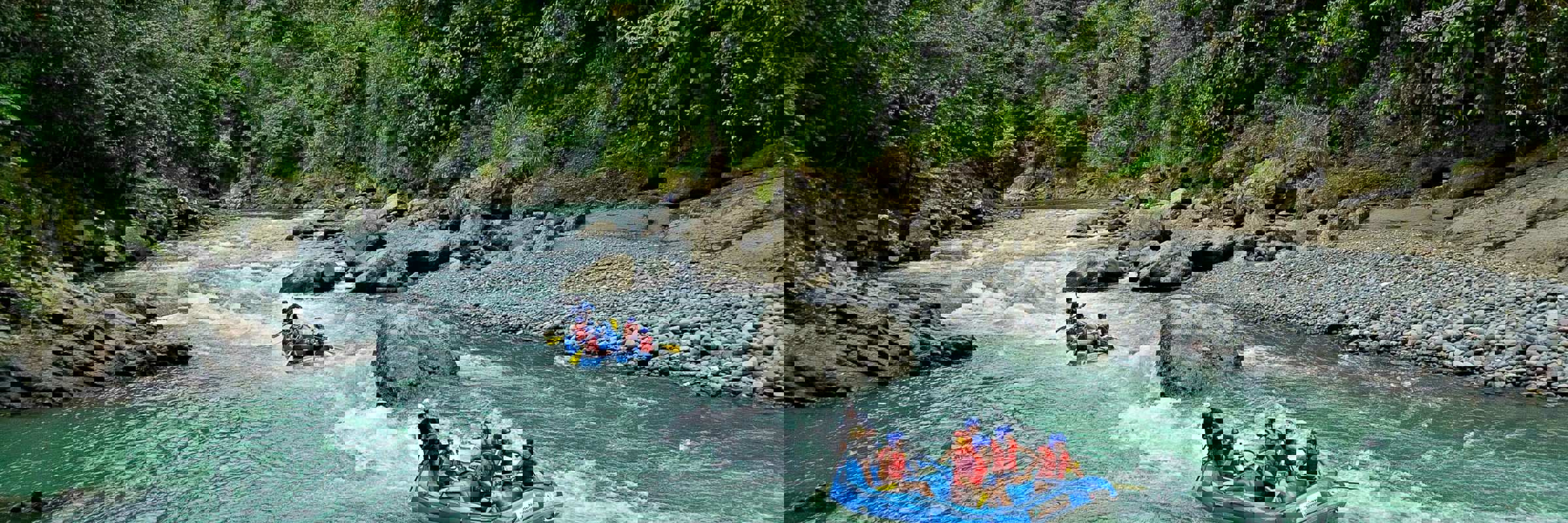 White-water rafting on the Pacuare River through lush rainforest in Costa Rica. 