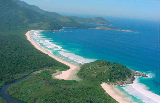 Aerial view of sweeping beaches and forested coastline on Ilha Grande.