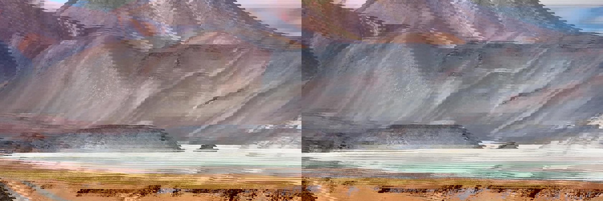 Multicolored mountains and salt flats in the Chilean Altiplano near San Pedro de Atacama. 