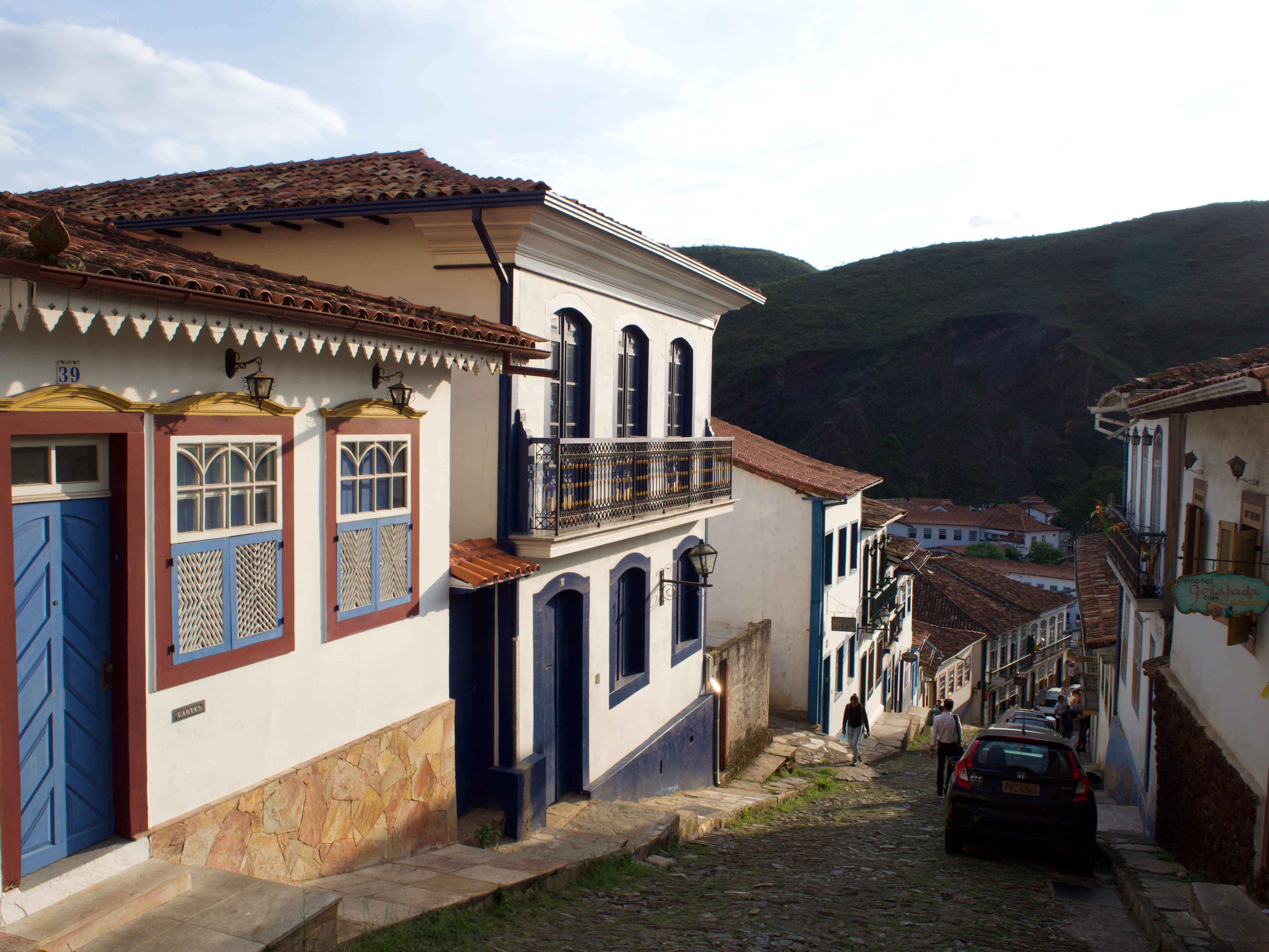 Colonial cobbled street with colourful colonial houses in Ouro Preto, Minas Gerais, Brazil. 