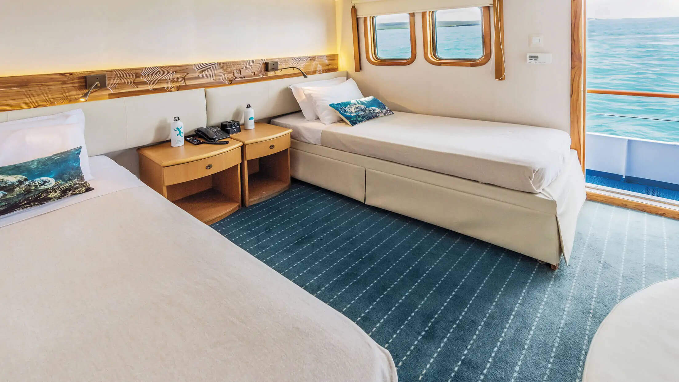 A spacious outside facing junior twin cabin on Coral I